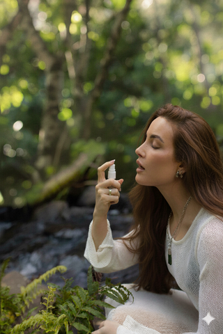 woman taking flower essences